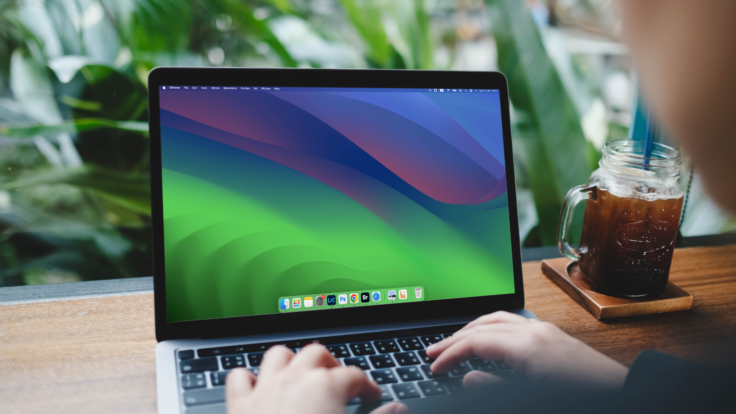 A person types on a MacBook