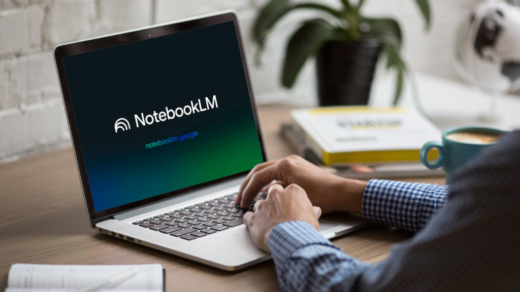Person types on a laptop showing the NotebookLM logo.